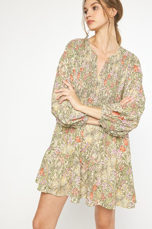 Floral paisley print tiered long sleeve mini dress featuring self-tie detail at neckline